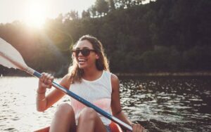 Smiling girl in a boat experienced tooth pain relief after root canal therapy in Chattanooga