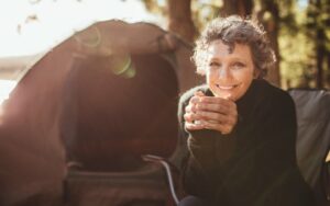 Smiling older woman with implant supported dentures from Dayton and South Pittsburg dentist