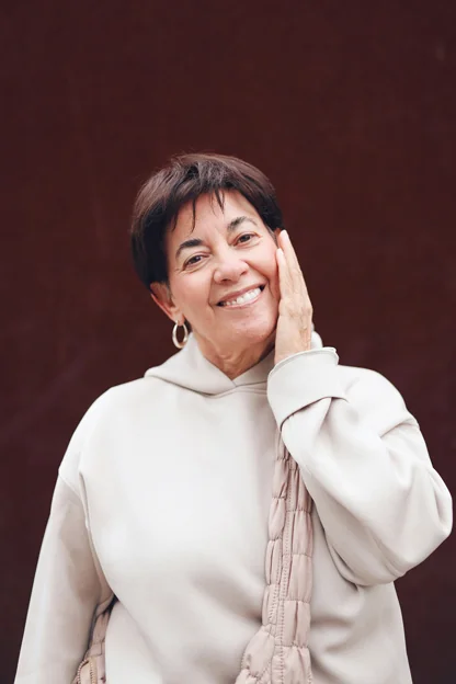 Smiling lady shows off her new teeth from dental implants in Chattanooga, TN