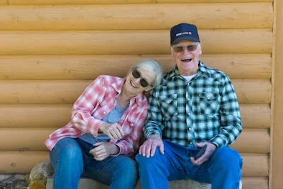 Laughing elderly couple received dentures to help replace missing teeth in Chattanooga, TN