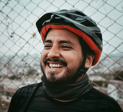Smiling man with bicycle helmet had broken tooth repaired after accident by Dr. Carico in Chattanooga, TN