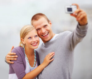 A couple of teenagers taking a picture after Invisalign treatment in Chattanooga.